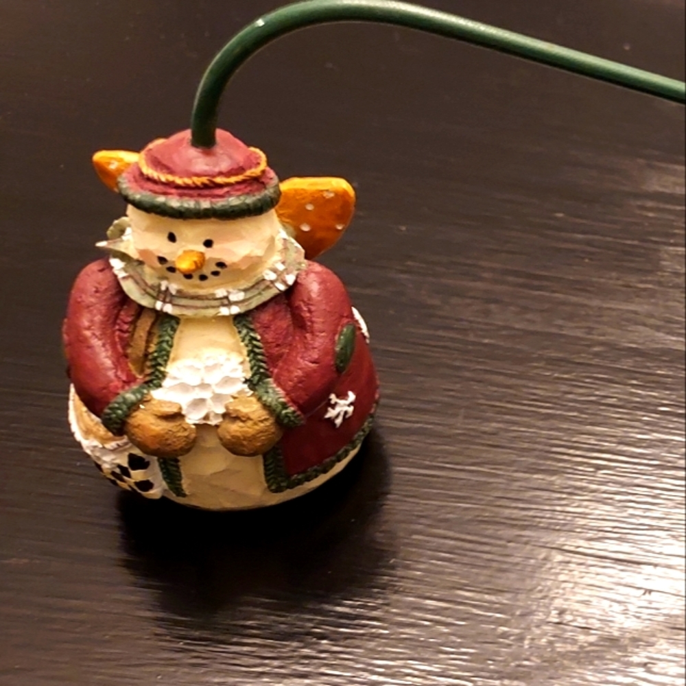 Holiday candle snuffer